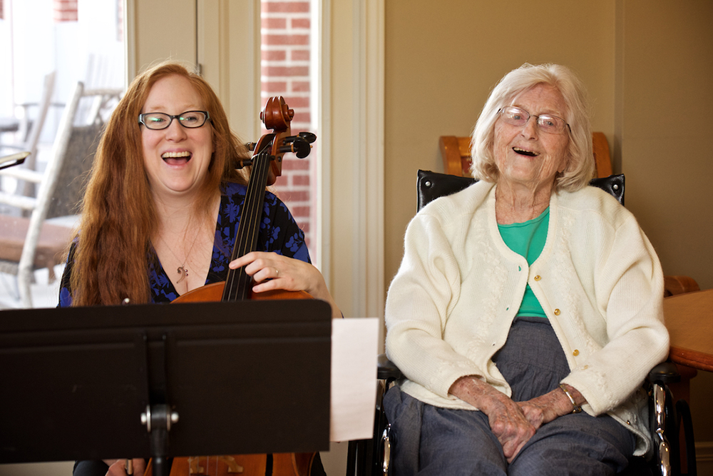 Senior citizen benefits from Signature Symphony music.