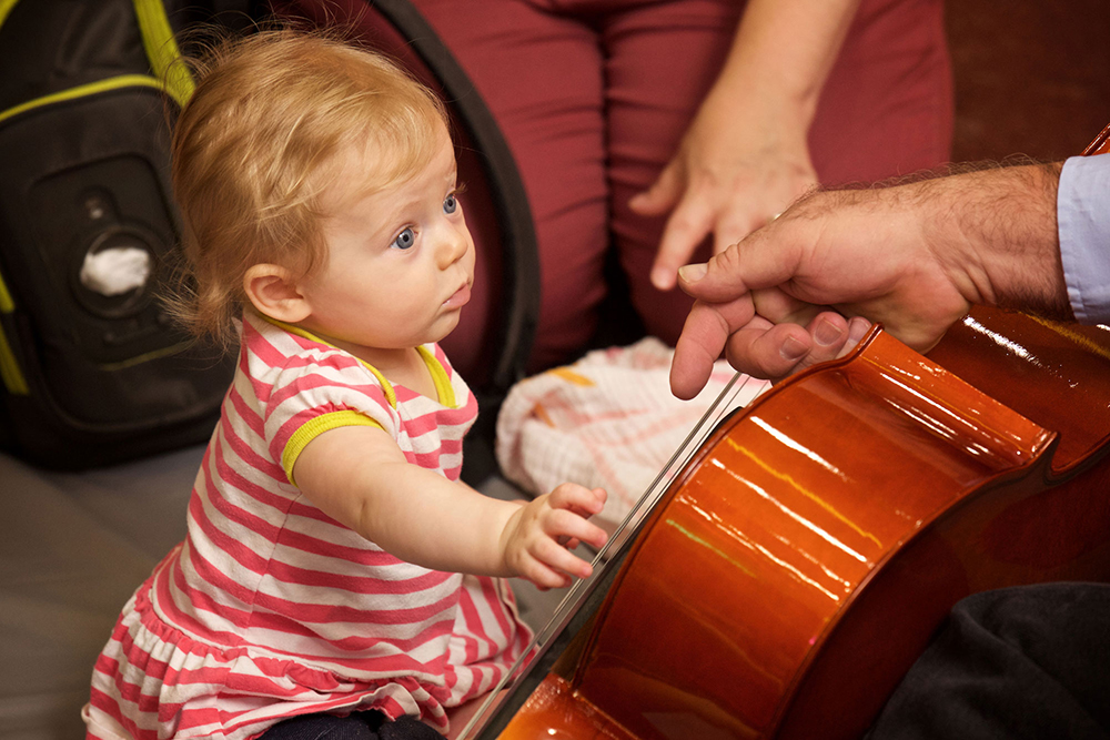 Young patron experiences music at the Seedling Symphony.